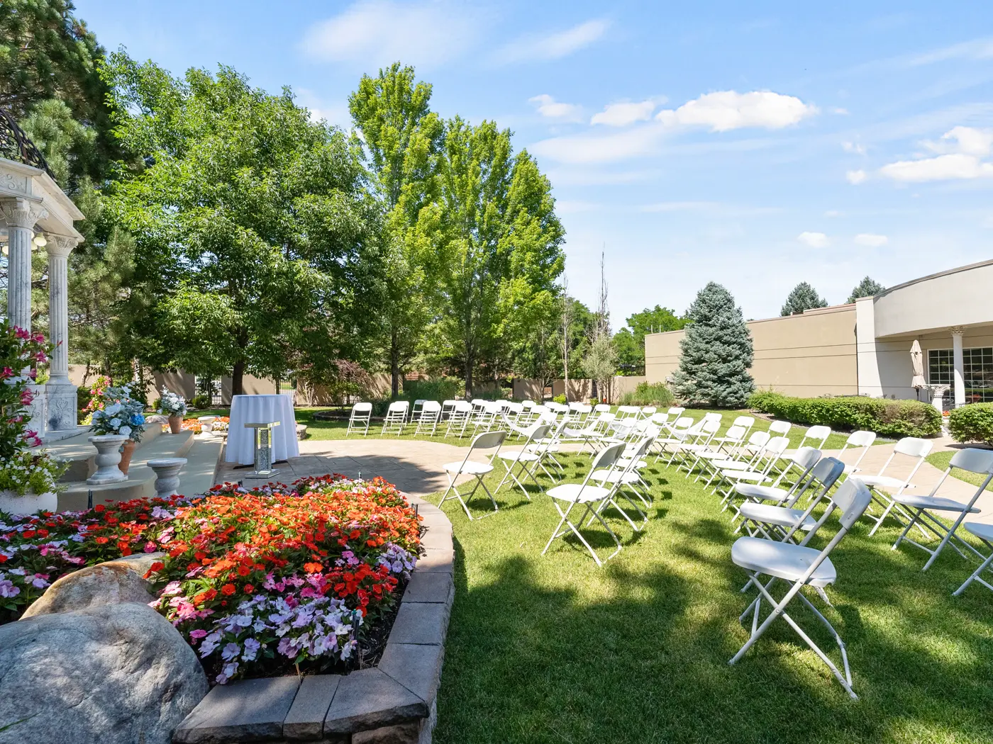 Wedding ceremony seating among the flowers